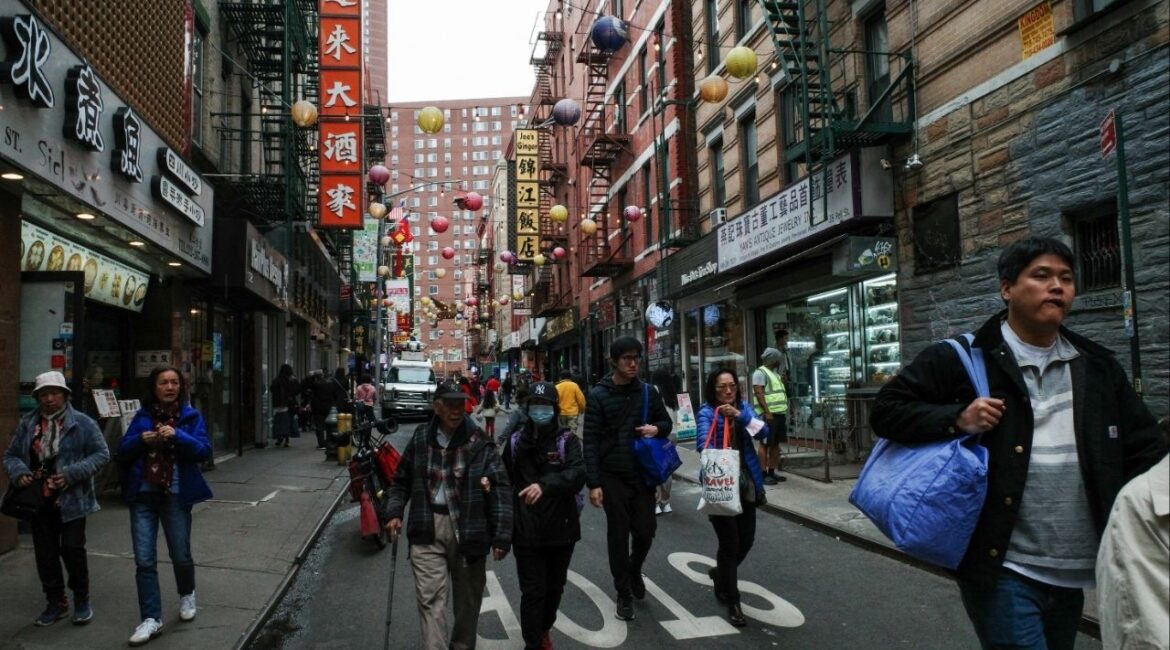 Tourists and pedestrians walk down Pell Street in the Chinatown neighborhood of Manhattan in New York City, U.S., April 14, 2025. (Reuters File)