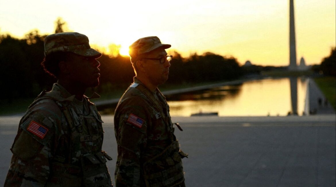 U.S. military members walk near the Washington Monument, after U.S. President Donald Trump announced the federal takeover of the Metropolitan Police Department under the Home Rule Act and the deployment of the National Guard to assist in crime prevention in the nation's capital, in Washington, D.C., August 14, 2025. (Reuters File)
