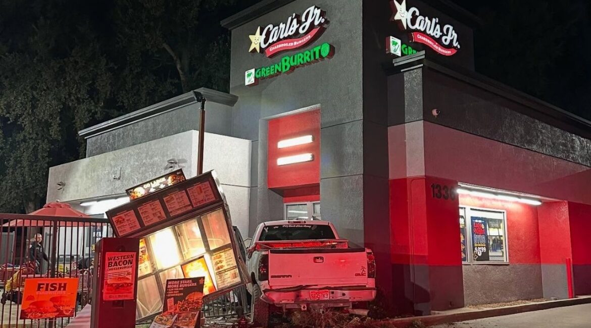 Visalia police arrested Brandon Smith, 30, on Monday night after they say he ran a red light, crashed into a minivan and then slammed his truck into a Carl’s Jr., though no injuries were reported. (Visalia PD)