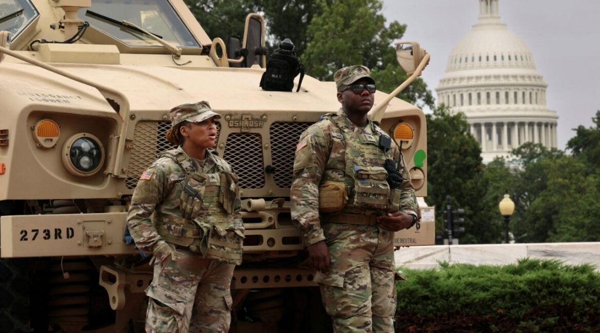 With the dome of the U.S. Capitol in the background, members of the DC National Guard keep watch outside Union Station after U.S. President Donald Trump deployed the National Guard and ordered an increased federal law enforcement presence to assist in crime prevention, in Washington, D.C., August 19, 2025. (Reuters File)