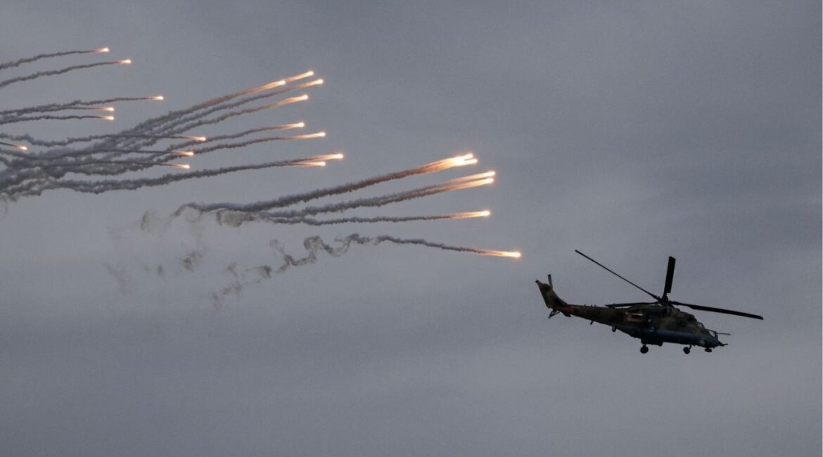A Belarusian Mi-35 attack helicopter flies during the joint Russia-Belarus "Zapad-2025" military drills near Borisov, Belarus September 15, 2025. (Reuters/Ramil Sitdikov)