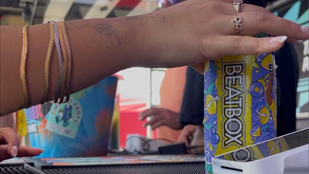 A festivalgoer grabs a BeatBox at Portola in San Francisco on Saturday, Sept. 20, 2025.