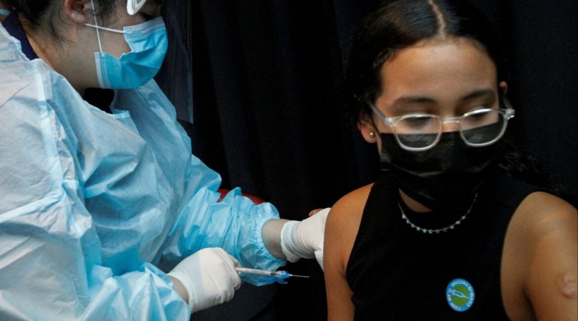 A girl is inoculated against the coronavirus disease (COVID-19) during a vaccination event hosted by Miami-Dade County and Miami Heat, at FTX Arena in Miami, Florida, U.S., August 5, 2021. (Reuters File)
