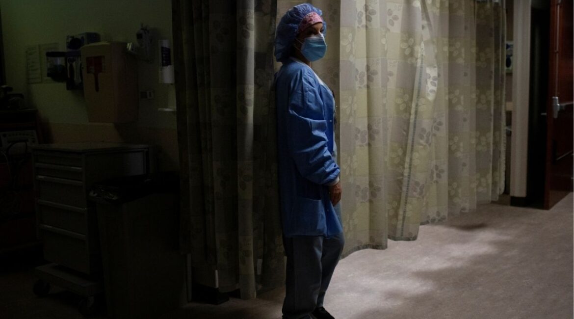 A nurse checks on a patient in the Triage area in a hospital in Royal Oak, Michigan, U.S., February 1, 2022. (Reuters File)