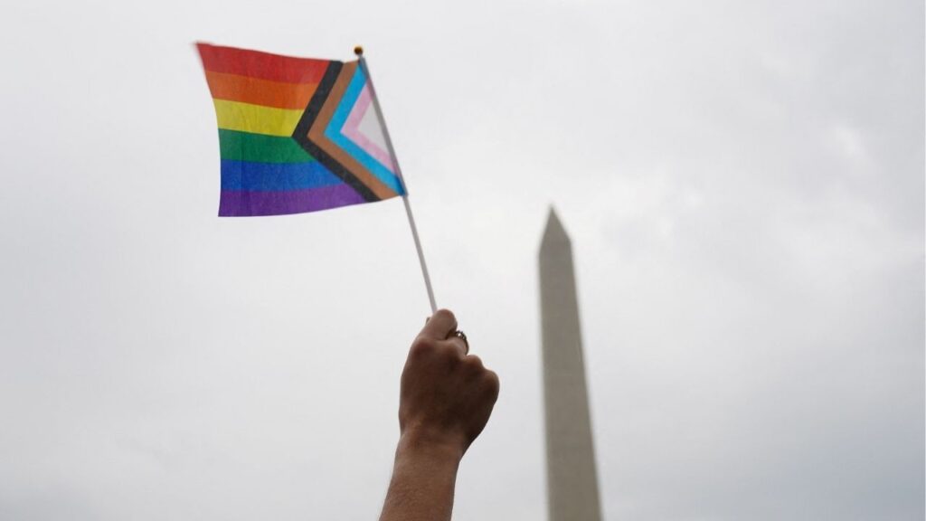 A person holds a Progress Pride Flag during the "International Rally + March on Washington for Freedom" in support of LGBTQ+ rights as part of WorldPride in Washington, D.C., U.S., June 8, 2025. (Reuters File)