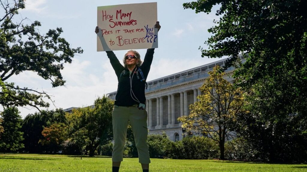 A person holds a placard during a rally in support of victims of late financier Jeffrey Epstein, on Capitol Hill in Washington, D.C., U.S., September 3, 2025. (Reuters File)