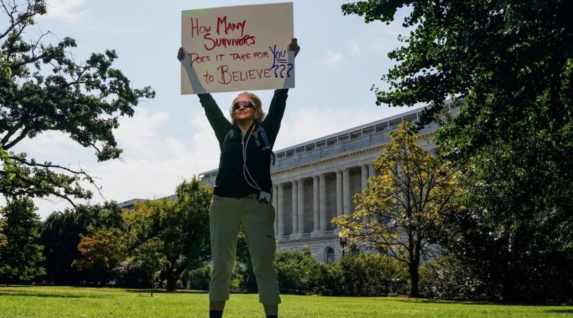 A person holds a placard during a rally in support of victims of late financier Jeffrey Epstein, on Capitol Hill in Washington, D.C., U.S., September 3, 2025. (Reuters File)