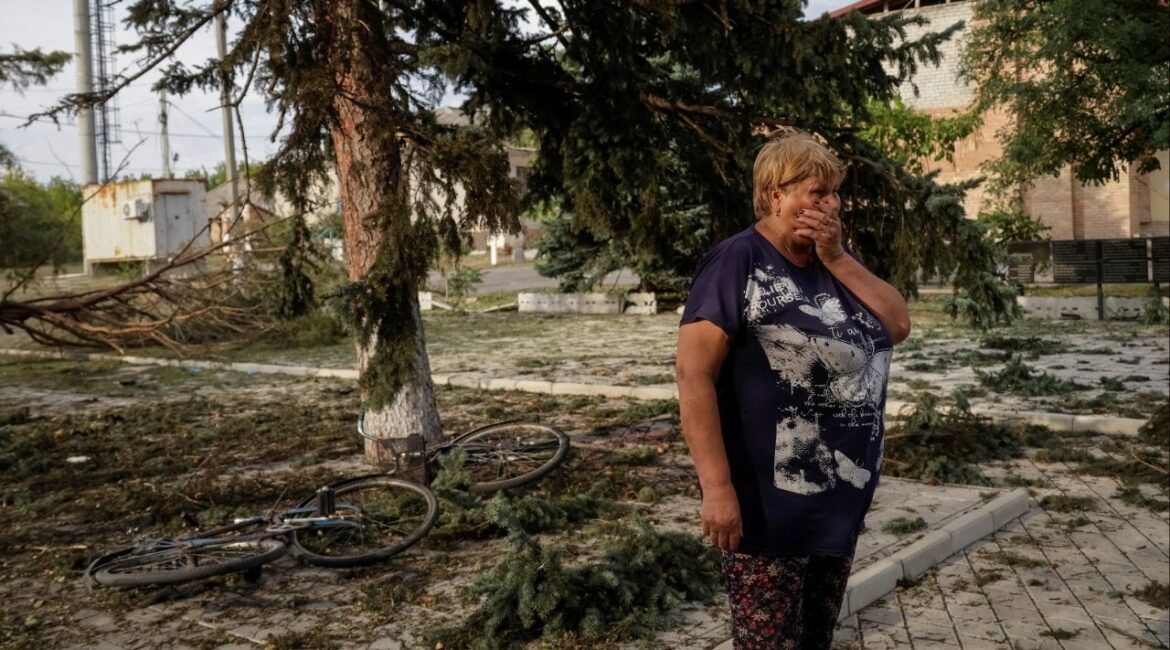 A resident stands at the site of a Russian air strike which killed several civilians at a pension disbursal point, officials said on Tuesday, amid Russia's attack on Ukraine, in the village of Yarova in Donetsk region, Ukraine September 9, 2025. REUTERS/Stringer
