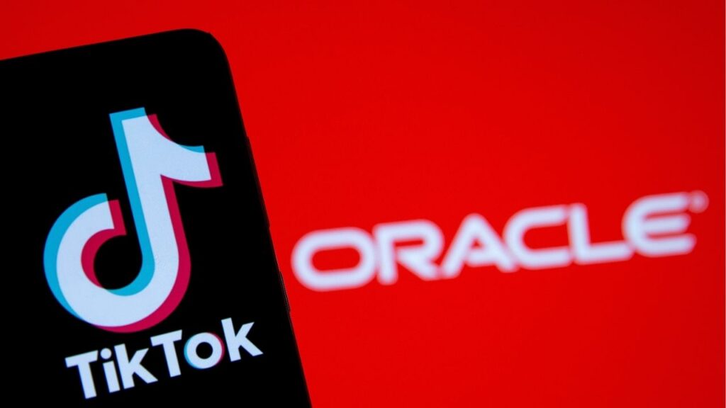 A smartphone with the Tik Tok logo is seen in front of a displayed Oracle logo in this illustration taken, Septemeber 14, 2020. (Reuters File)