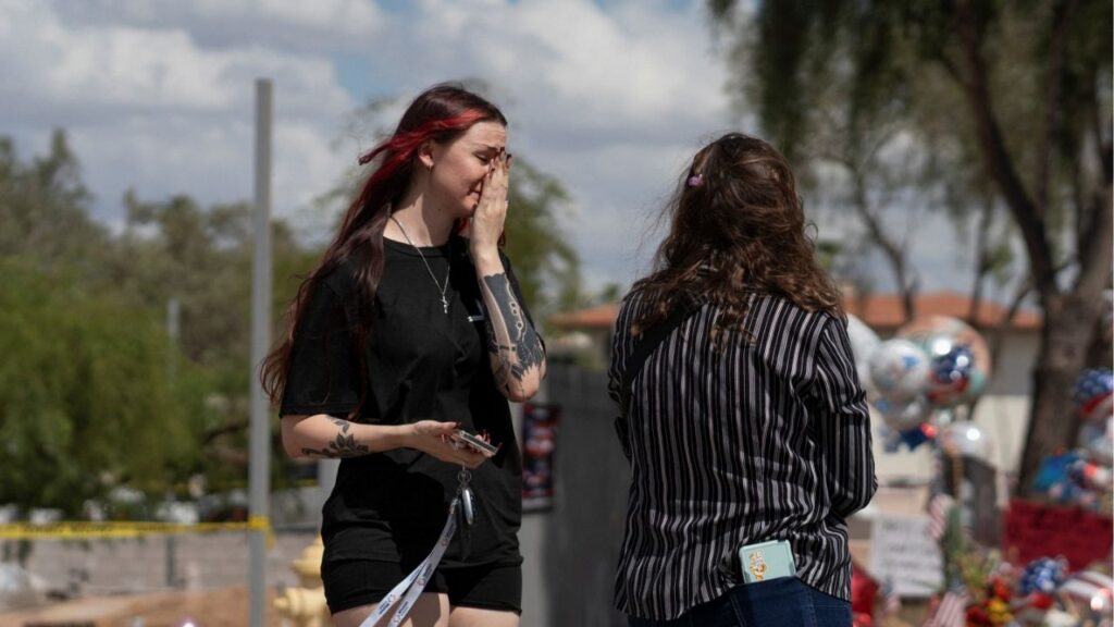 A woman cries as people mourn following the fatal shooting of conservative activist Charlie Kirk, at the Turning Point USA headquarters in Phoenix, Arizona, U.S., September 12, 2025. (Reuters File)