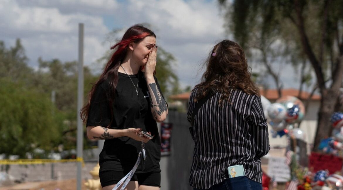 A woman cries as people mourn following the fatal shooting of conservative activist Charlie Kirk, at the Turning Point USA headquarters in Phoenix, Arizona, U.S., September 12, 2025. (Reuters File)