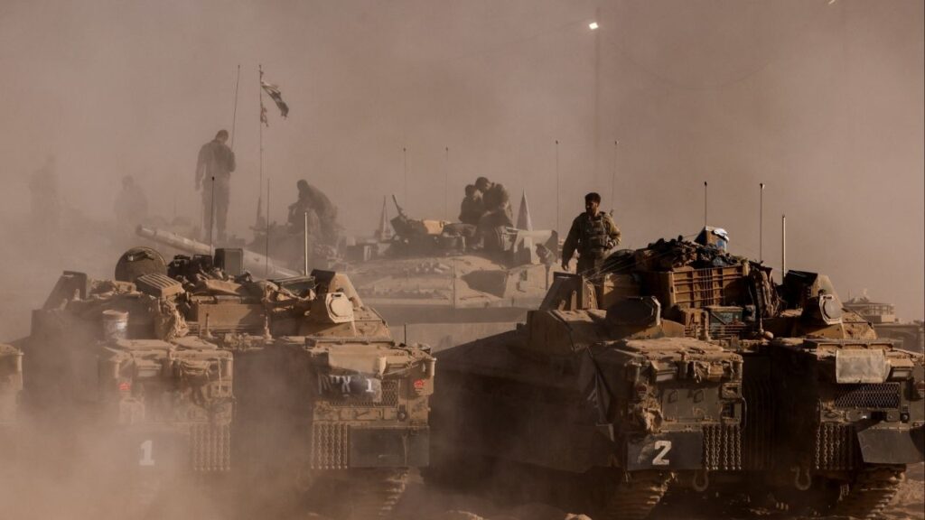 An Israeli soldier stands on top of a military vehicle at the Israel-Gaza border, as seen from Israel, August 26, 2025. (Reuters File)