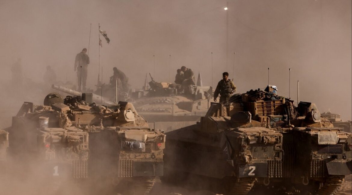 An Israeli soldier stands on top of a military vehicle at the Israel-Gaza border, as seen from Israel, August 26, 2025. (Reuters File)