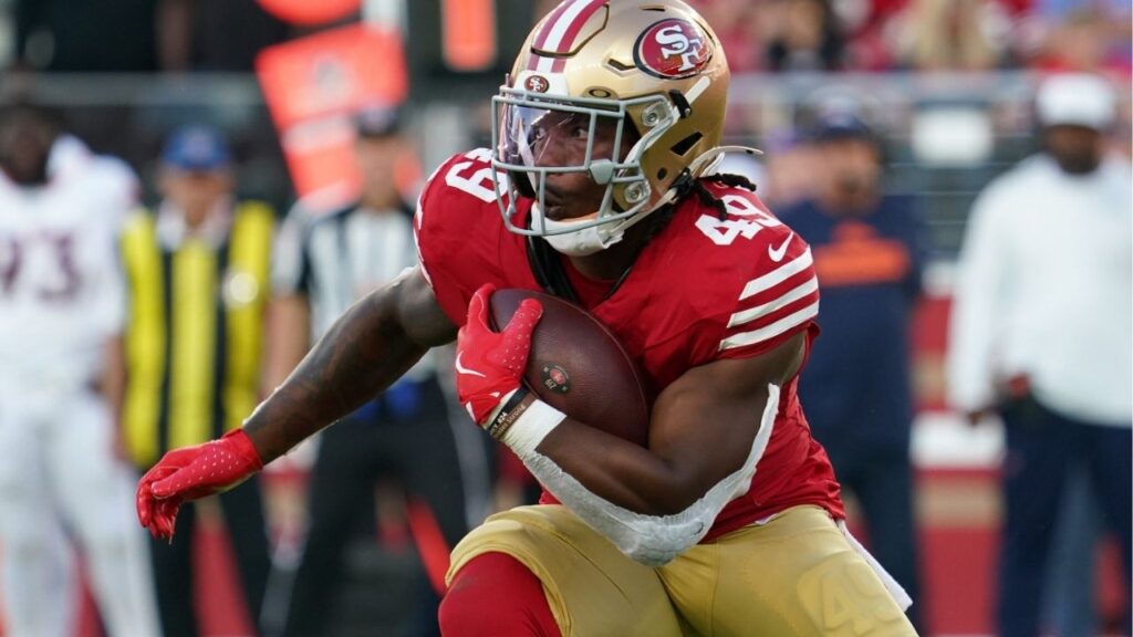 Aug 9, 2025; Santa Clara, California, USA; San Francisco 49ers running back Corey Kiner (49) runs the ball in the second quarter against Denver Broncos at Levi's Stadium. (David Gonzales-Imagn Images)