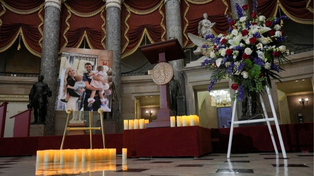 Candles and flowers are placed near an image of conservative activist Charlie Kirk with his family, during a vigil for him in Statuary Hall of the U.S. Capitol in Washington, D.C., U.S., September 15, 2025. (Reuters File)