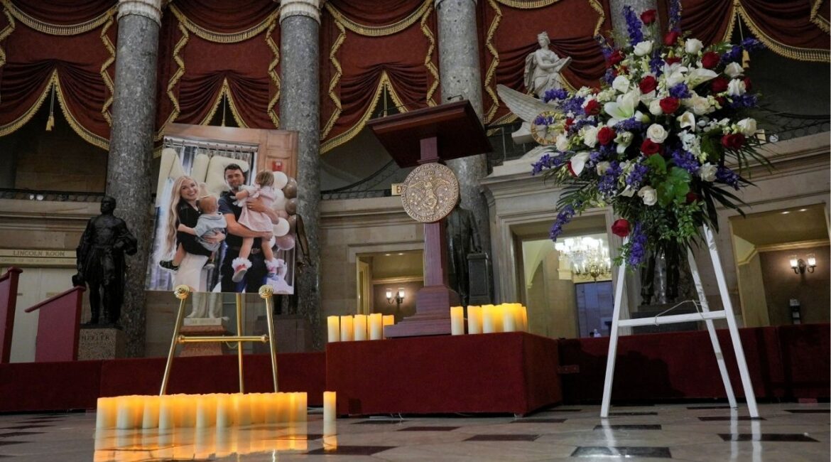 Candles and flowers are placed near an image of conservative activist Charlie Kirk with his family, during a vigil for him in Statuary Hall of the U.S. Capitol in Washington, D.C., U.S., September 15, 2025. (Reuters File)