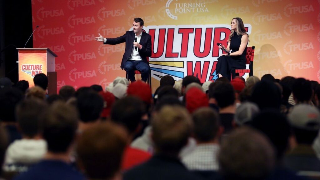 Charlie Kirk, left, sitting beside Lara Trump, the wife of Eric Trump, motions toward the audience during a Turning Point USA event, Wed. Nov. 13, 2019, at North Carolina State University, in Raleigh, N.C. As one of the most influential right-wing activists in the United States, Charlie Kirk shaped much of the hard-right youth movement on key political issues. (Veasey Conway/The New York Times)