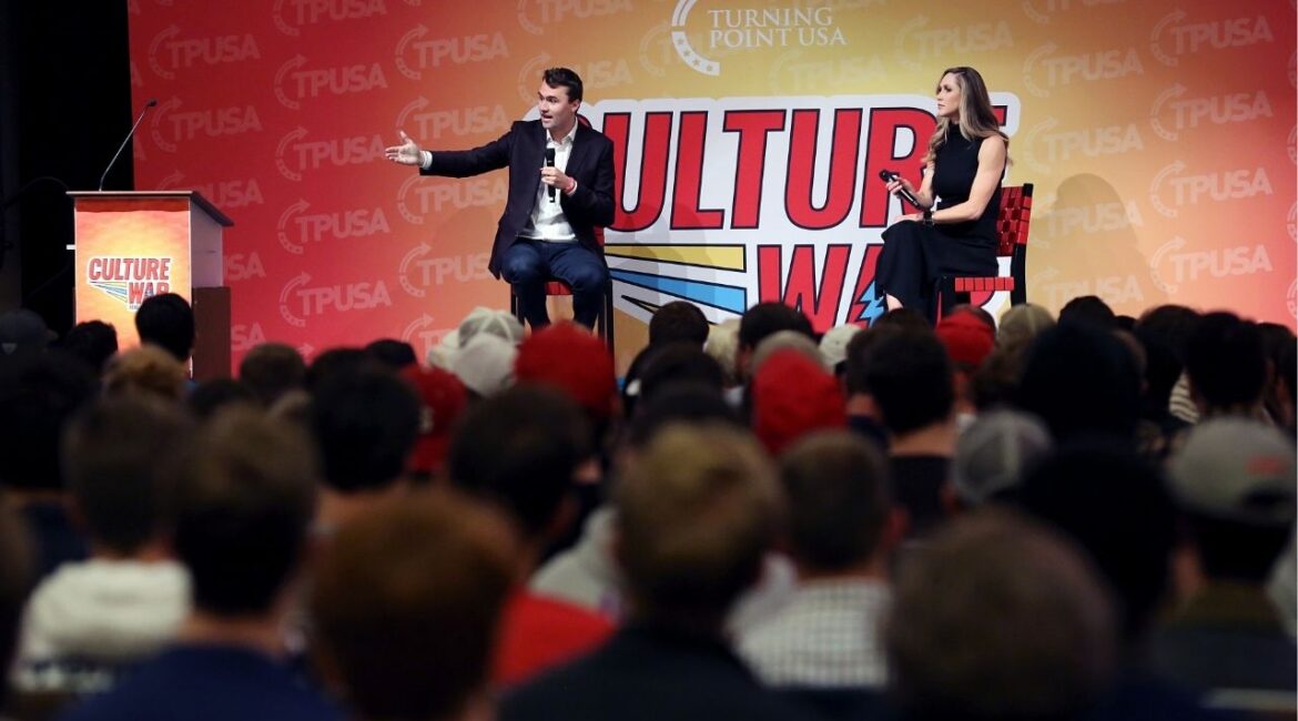 Charlie Kirk, left, sitting beside Lara Trump, the wife of Eric Trump, motions toward the audience during a Turning Point USA event, Wed. Nov. 13, 2019, at North Carolina State University, in Raleigh, N.C. As one of the most influential right-wing activists in the United States, Charlie Kirk shaped much of the hard-right youth movement on key political issues. (Veasey Conway/The New York Times)