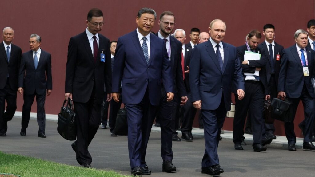 Chinese President Xi Jinping and Russian President Vladimir Putin walk at the personal residence of the Chinese leader Zhongnanhai in Beijing, China September 2, 2025. Sputnik/Alexander Kazakov/Pool via REUTERS