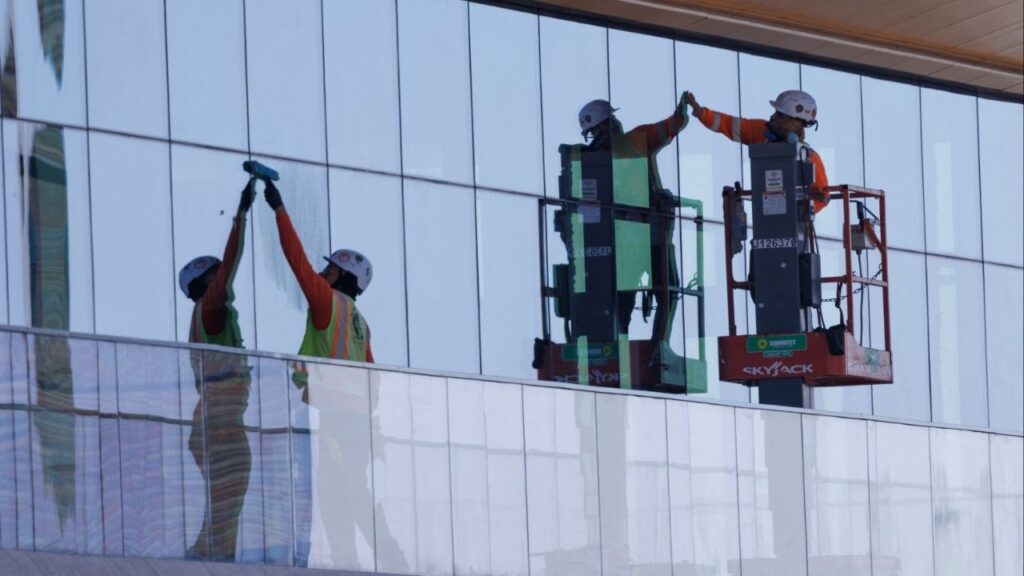 Construction workers install windows on a nearly completed office building in San Diego, California, U.S., October 9, 2024. (Reuters File)