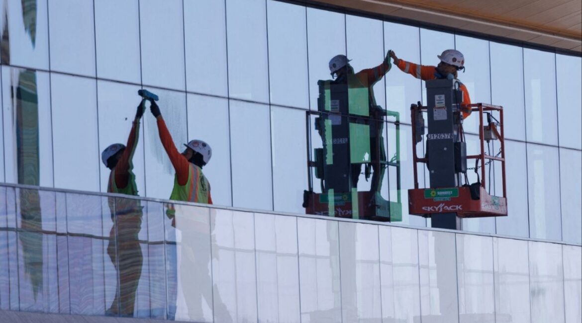 Construction workers install windows on a nearly completed office building in San Diego, California, U.S., October 9, 2024. (Reuters File)