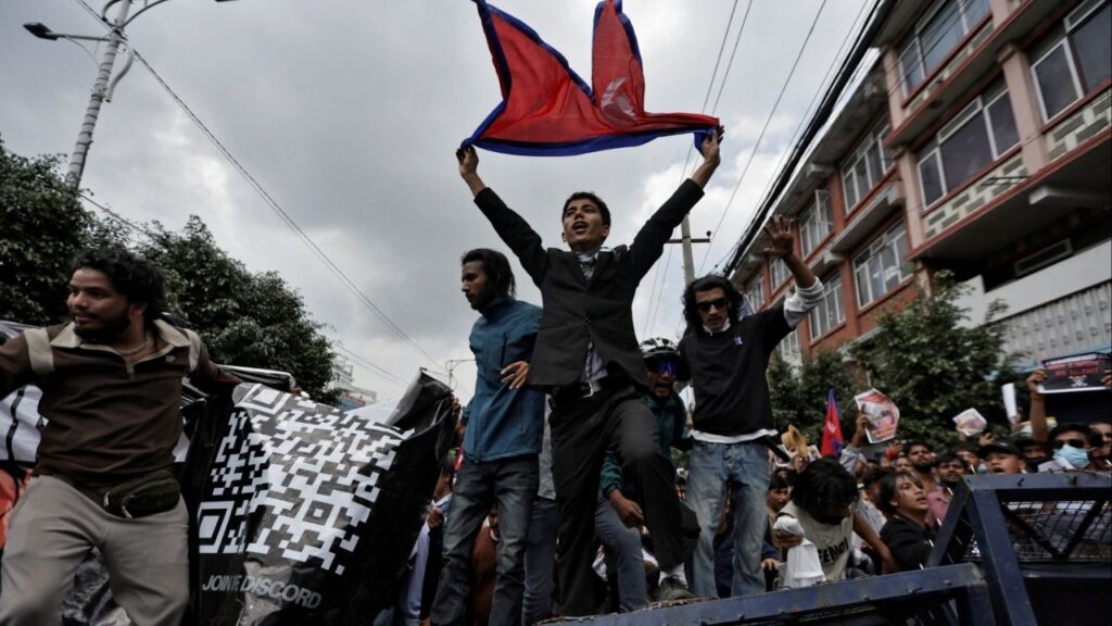 Demonstrators shout slogans as they stand on a barricade during a protest against corruption and the government’s decision to block several social media platforms, in Kathmandu, Nepal September 8, 2025. (Reuters/Navesh Chitrakar)