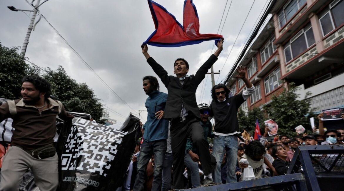 Demonstrators shout slogans as they stand on a barricade during a protest against corruption and the government’s decision to block several social media platforms, in Kathmandu, Nepal September 8, 2025. (Reuters/Navesh Chitrakar)