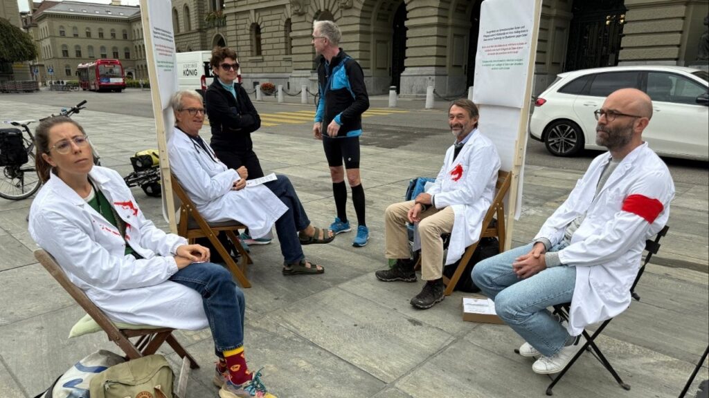 Doctors Michele Ghielmini, Brenno Balestra, Alessandra Guaita and Marco Franzi sit outside the Swiss Parliament building (Bundeshaus) at the start of their hunger strike over Gaza, calling on their government to apply targeted sanctions on Israel over its alleged violations of international law and to recognise a Palestinian state, in Bern, Switzerland, September 8, 2025. (Reuters/Cecile Mantovani)