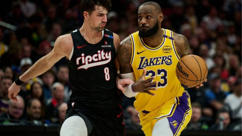 Feb 20, 2025; Portland, Oregon, USA; Los Angeles Lakers forward LeBron James (23) drives to the basket during the second half against Portland Trail Blazers forward Deni Avdija (8) at Moda Center. (Troy Wayrynen-Imagn Images)