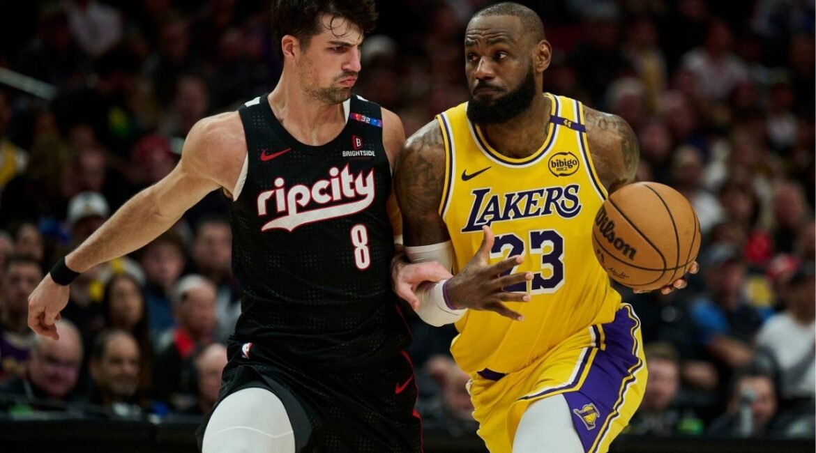 Feb 20, 2025; Portland, Oregon, USA; Los Angeles Lakers forward LeBron James (23) drives to the basket during the second half against Portland Trail Blazers forward Deni Avdija (8) at Moda Center. (Troy Wayrynen-Imagn Images)