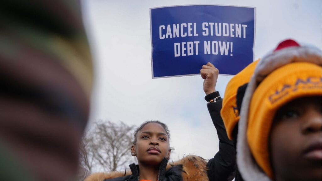 Feb 28, 2023; Washington, DC, USA; Protestors gather outside the U.S. Supreme Court ahead of the oral arguments in two cases that challenge President Joe Biden's $400 billion student loan forgiveness plan. (USA Today Network via Reuters)