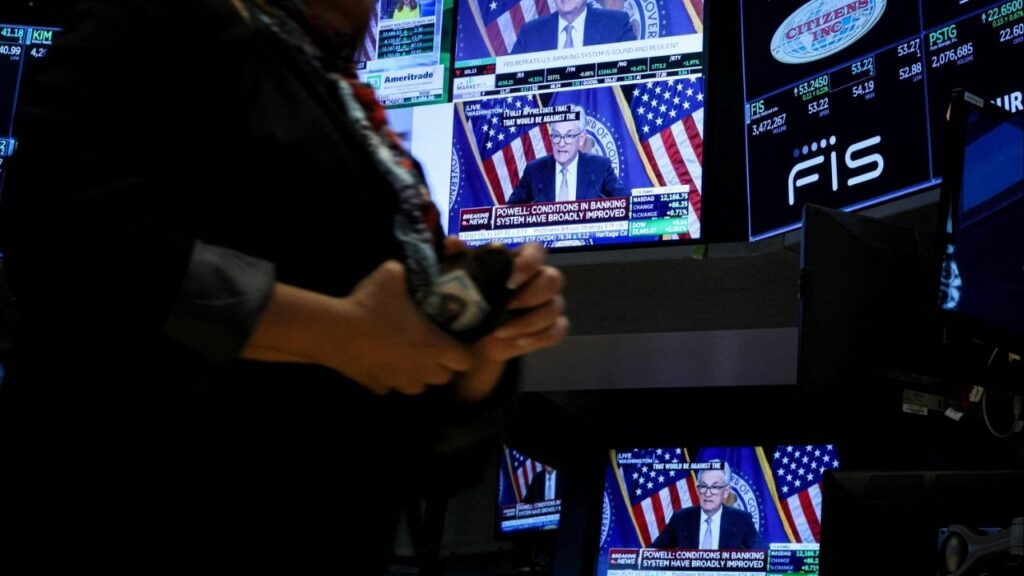 Federal Reserve Chair Jerome Powell is seen delivering remarks on screens, on the floor of the New York Stock Exchange (NYSE) in New York City, U.S., May 3, 2023. (Reuters File)