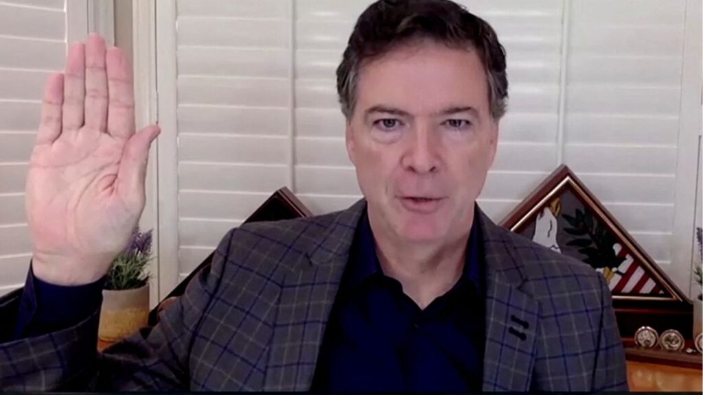 James Comey, former director of the Federal Bureau of Investigation (FBI), is seen in a frame grab from a video feed as he is sworn in remotely from his home during a Senate Judiciary Committee hearing exploring the FBI's investigation of the 2016 Trump campaign and Russian election interference in Washington, U.S., September 30, 2020. U.S. Senate Committee on the Judiciary/Handout via REUTERS/File Photo