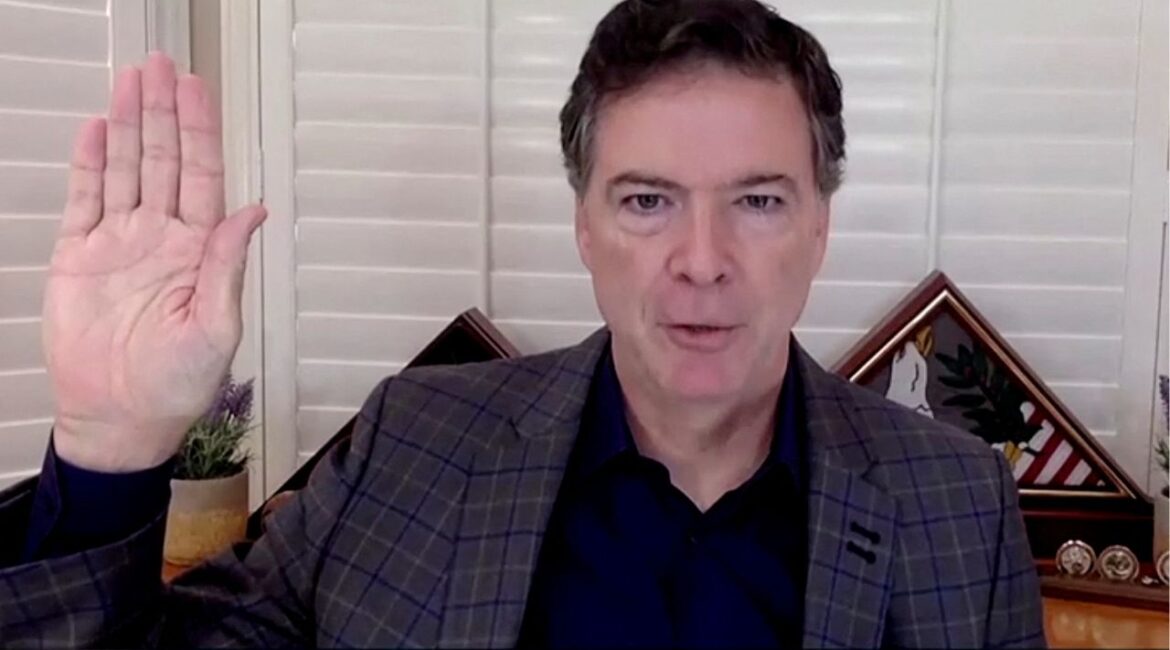 James Comey, former director of the Federal Bureau of Investigation (FBI), is seen in a frame grab from a video feed as he is sworn in remotely from his home during a Senate Judiciary Committee hearing exploring the FBI's investigation of the 2016 Trump campaign and Russian election interference in Washington, U.S., September 30, 2020. U.S. Senate Committee on the Judiciary/Handout via REUTERS/File Photo