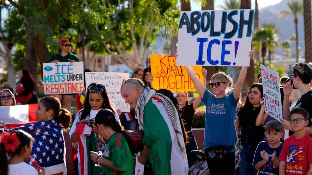 Kara Wahlin of Palm Desert holds a sign saying 'Abolish Ice!' while protesting President Trump's immigration policies in downtown Cathedral City, Calif., on Wednesday, Feb. 5, 2025. (USA Today Network via Reuters)
