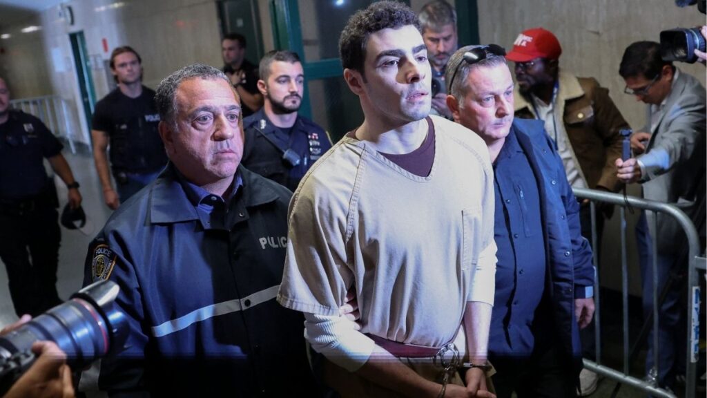 Luigi Mangione, the suspect in the killing of UnitedHealthcare chief executive Brian Thompson, is escorted at Manhattan Supreme Court on the day he appears on New York State murder and terrorism charges, in New York City, U.S., September 16, 2025. (Reuters/Mike Segar)