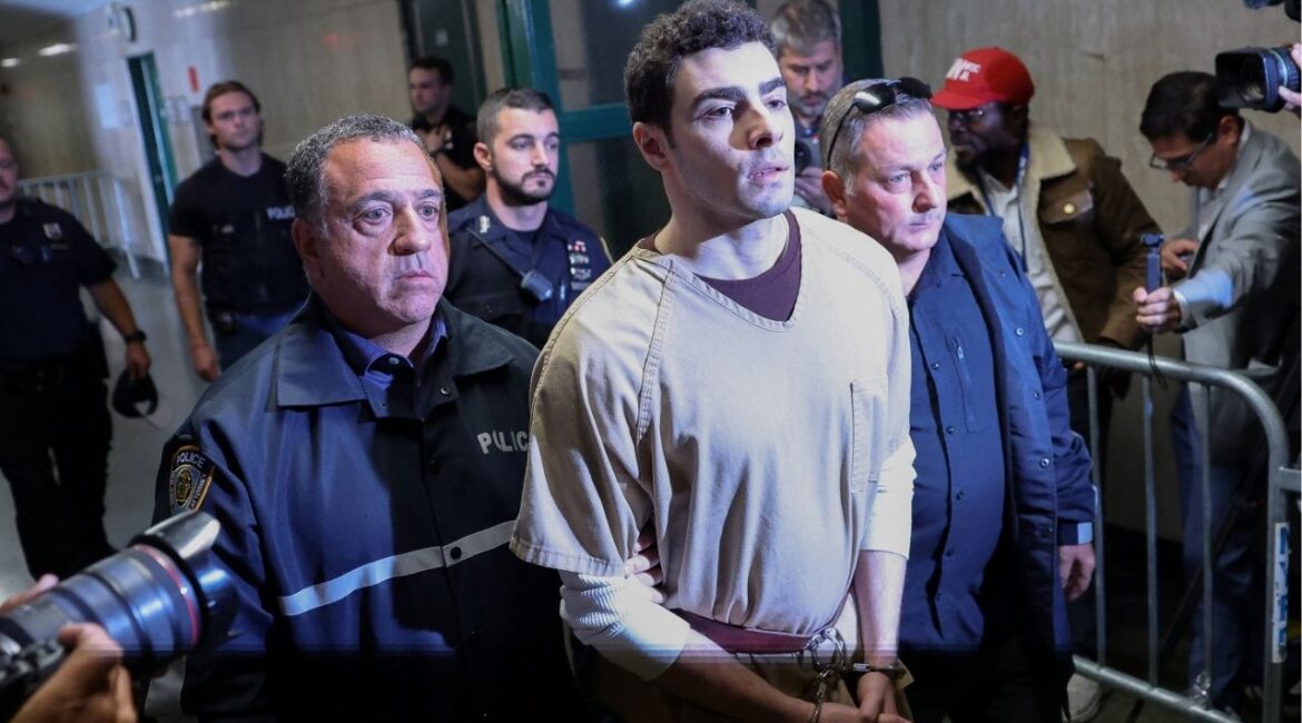 Luigi Mangione, the suspect in the killing of UnitedHealthcare chief executive Brian Thompson, is escorted at Manhattan Supreme Court on the day he appears on New York State murder and terrorism charges, in New York City, U.S., September 16, 2025. (Reuters/Mike Segar)