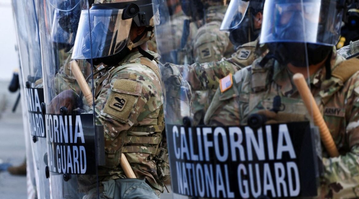 National Guard troops wear gas masks during protests against federal immigration sweeps, in Los Angeles, California, U.S., June 12, 2025. (Reuters File)