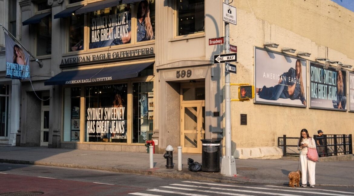People stand near an American Eagle ad campaign featuring Sydney Sweeney in New York City, U.S., August 4, 2025. (Reuters File)