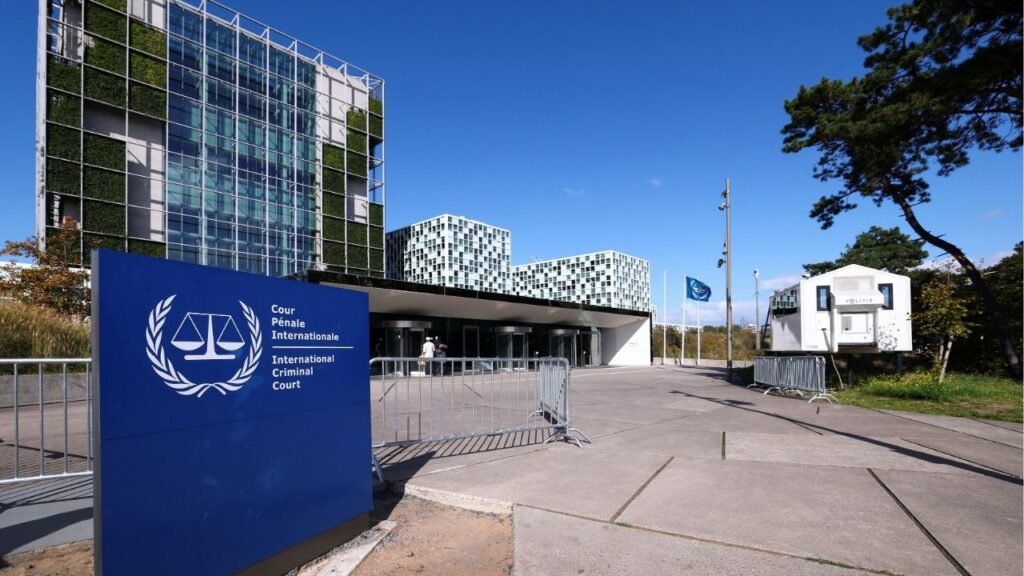 People stand outside the International Criminal Court (ICC) as the United States is considering imposing sanctions as soon as this week against the entire International Criminal Court, in The Hague, Netherlands, September 22, 2025. (Reuters/Piroschka van de Wouw)