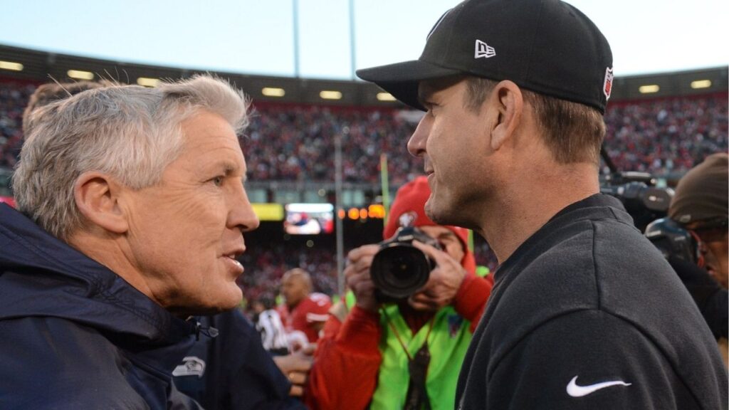 San Francisco, CA, USA; Seattle Seahawks head coach Pete Carroll (left) shakes hands with San Francisco 49ers head coach Jim Harbaugh (right) after the game at Candlestick Park. The 49ers defeated the Seahawks 19-17. (Kyle Terada-USA TODAY Sports)