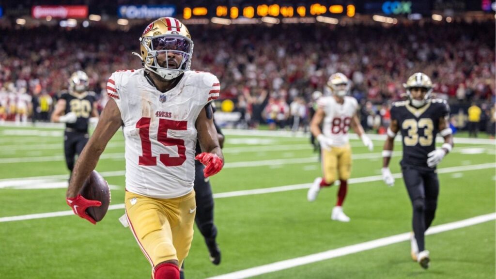 Sep 14, 2025; New Orleans, Louisiana, USA; San Francisco 49ers wide receiver Jauan Jennings (15) runs in for a touchdown against New Orleans Saints safety Justin Reid (21) during the second half at Caesars Superdome. (Stephen Lew-Imagn Images)