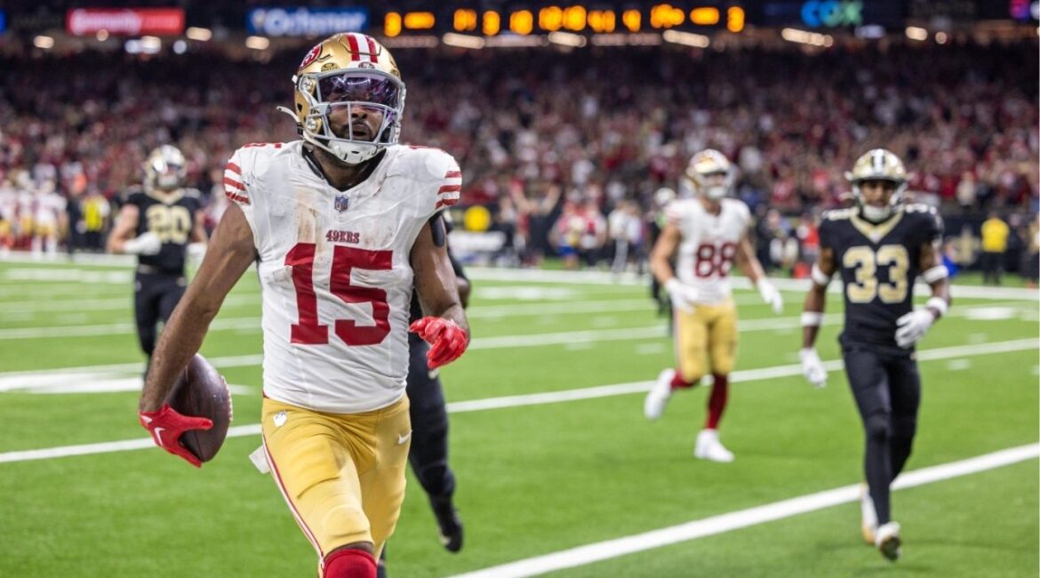 Sep 14, 2025; New Orleans, Louisiana, USA; San Francisco 49ers wide receiver Jauan Jennings (15) runs in for a touchdown against New Orleans Saints safety Justin Reid (21) during the second half at Caesars Superdome. (Stephen Lew-Imagn Images)