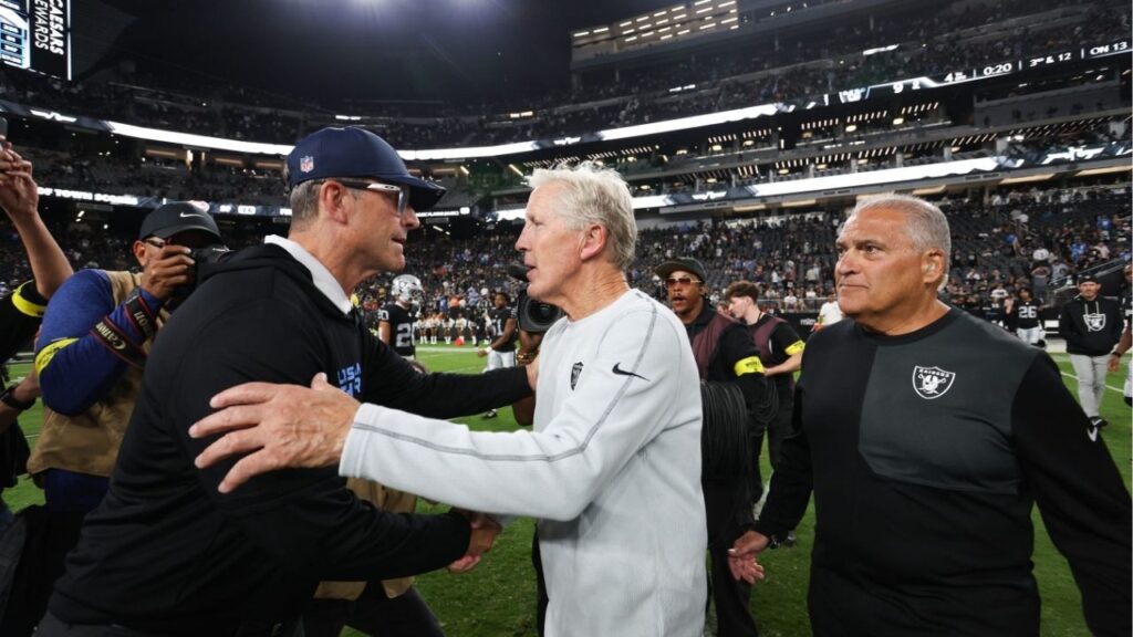 Sep 15, 2025; Paradise, Nevada, USA; Las Vegas Raiders head coach Pete Carroll and Los Angeles Chargers head coach Jim Harbaugh shake hands after the game at Allegiant Stadium. (Kiyoshi Mio-Imagn Images)