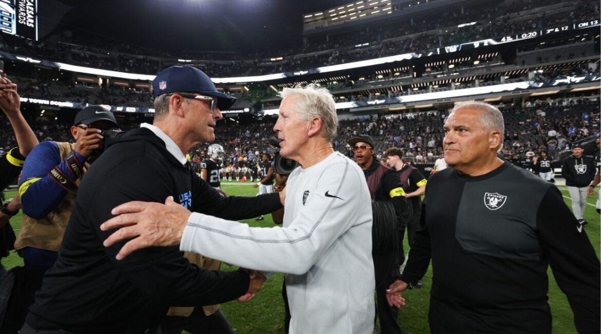 Sep 15, 2025; Paradise, Nevada, USA; Las Vegas Raiders head coach Pete Carroll and Los Angeles Chargers head coach Jim Harbaugh shake hands after the game at Allegiant Stadium. (Kiyoshi Mio-Imagn Images)