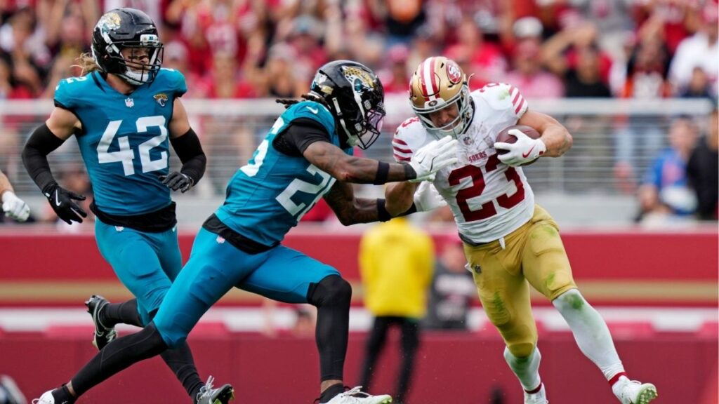 Sep 28, 2025; Santa Clara, California, USA; San Francisco 49ers running back Christian McCaffrey (23) runs the ball during the second half against the Jacksonville Jaguars at Levi's Stadium. (Kyle Terada-Imagn Images)