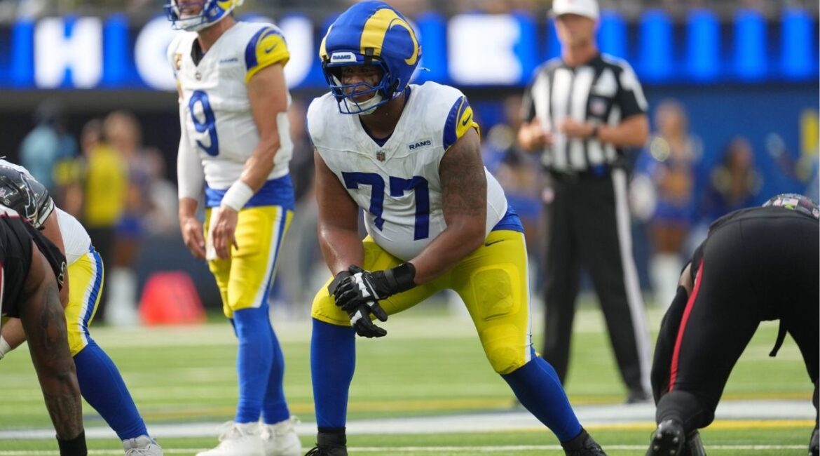 Sep 7, 2025; Inglewood, California, USA; Los Angeles Rams offensive tackle Alaric Jackson (77) wears a Guardian helmet cap in the second half against the Houston Texans at SoFi Stadium. (Kirby Lee-Imagn Images)