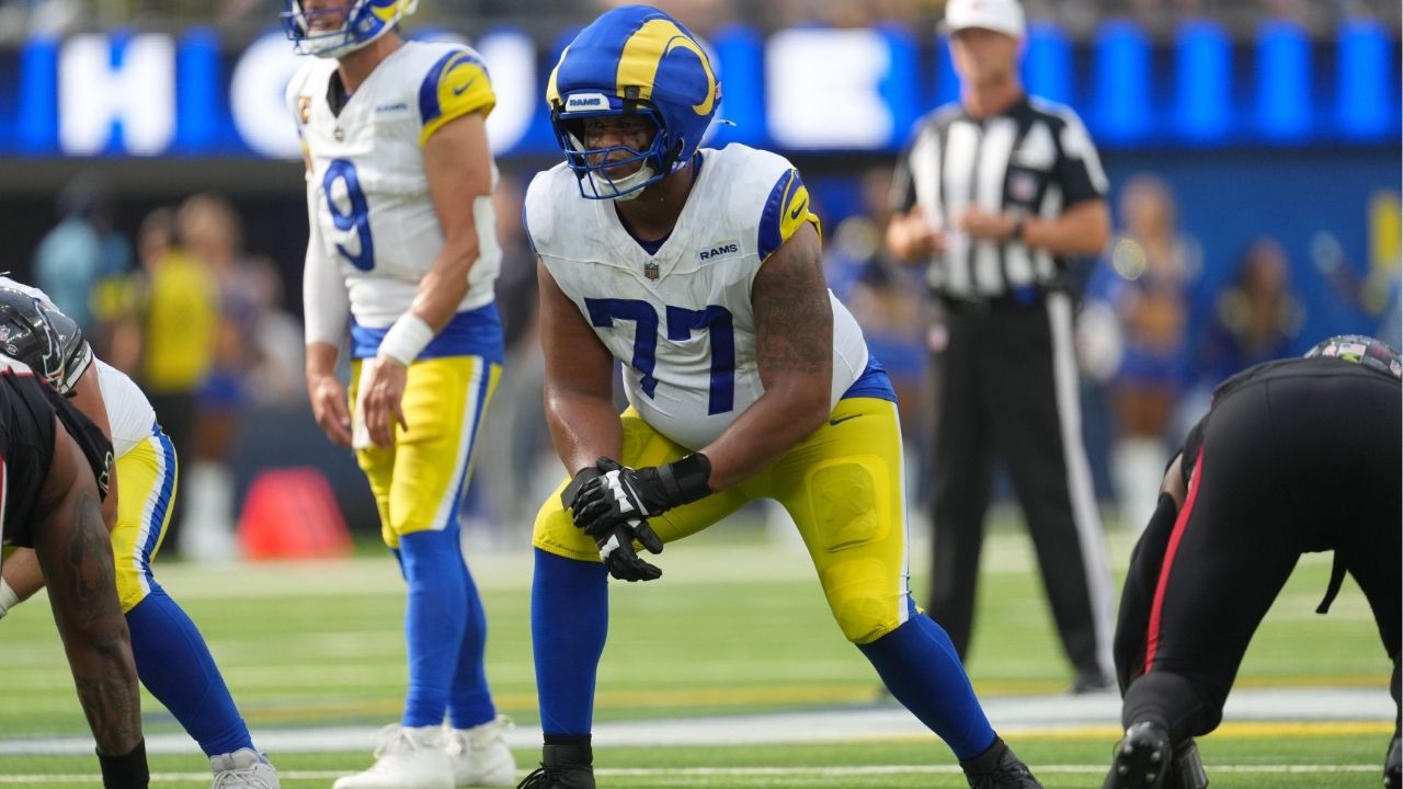 Sep 7, 2025; Inglewood, California, USA; Los Angeles Rams offensive tackle Alaric Jackson (77) wears a Guardian helmet cap in the second half against the Houston Texans at SoFi Stadium. (Kirby Lee-Imagn Images)