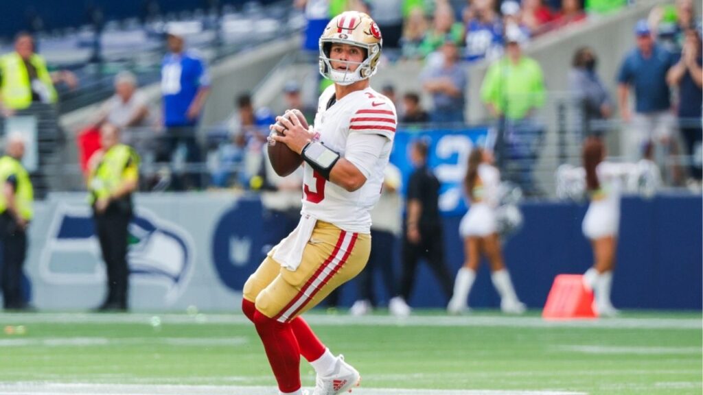 Sep 7, 2025; Seattle, Washington, USA; San Francisco 49ers quarterback Brock Purdy (13) looks to pass against the Seattle Seahawks during the third quarter at Lumen Field. (Joe Nicholson-Imagn Images)