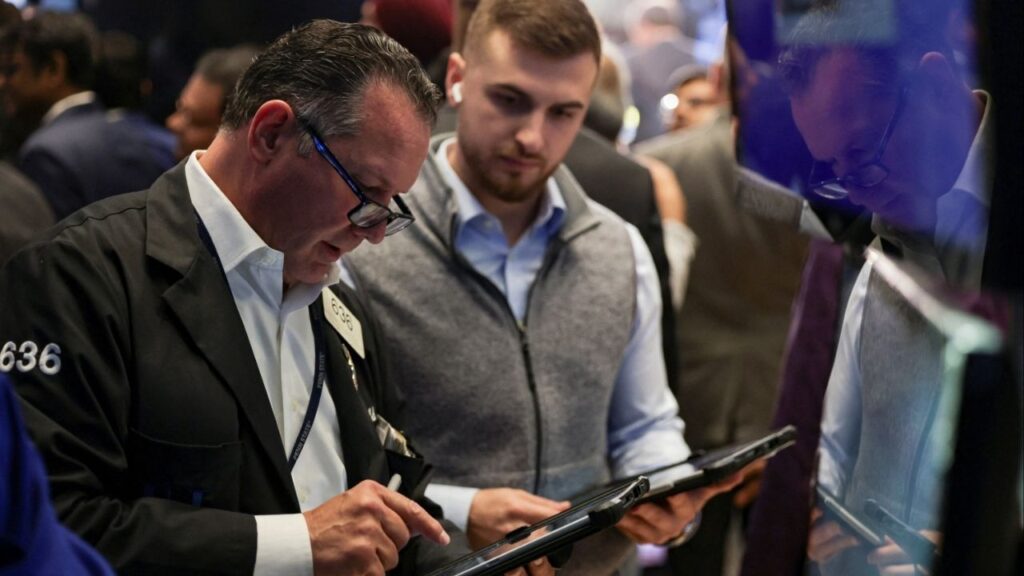 Traders work on the floor at the New York Stock Exchange (NYSE) in New York City, U.S., September 8, 2025. (Reuters/Jeenah Moon)